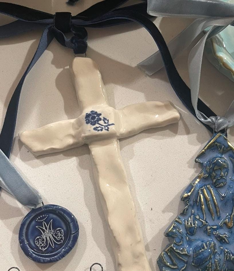 blue and white ceramic cross